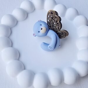 Melsvas meškiukas su sparnais